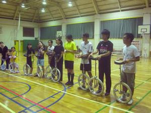 Harvey Mudd Watson Fellow Srisuknimit in Japan with the team that did figure unicycling.